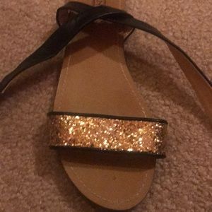 Gold sparkle sandals.